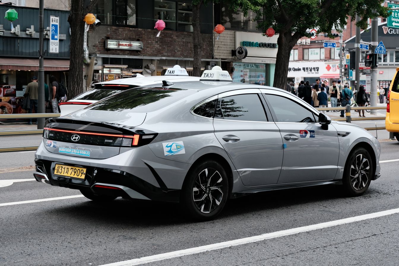 Modern Hyundai taxi on a busy Seoul street — best taxi apps for foreigners in Korea